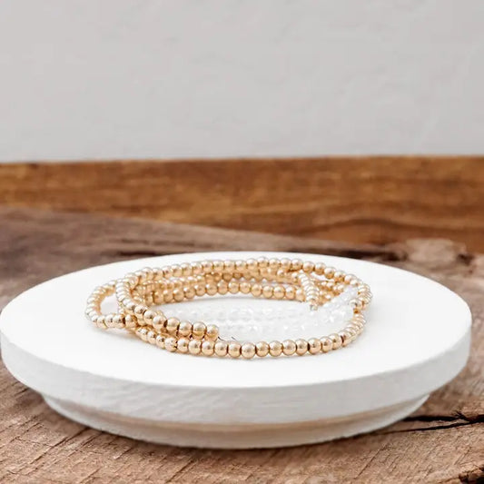 Gold and White Worn Bracelet Stack